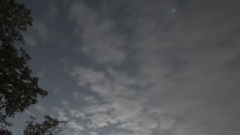 Clouds-And-Stars-Moving-Across-Night-Sky,-Time-Lapse-From-Rooftop