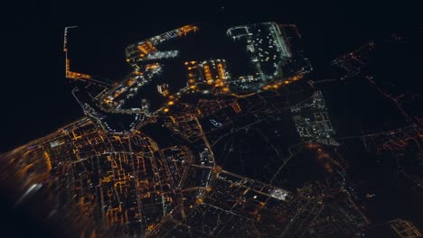 Night-aerial-view-of-Alicante,-taken-from-an-aeroplane
