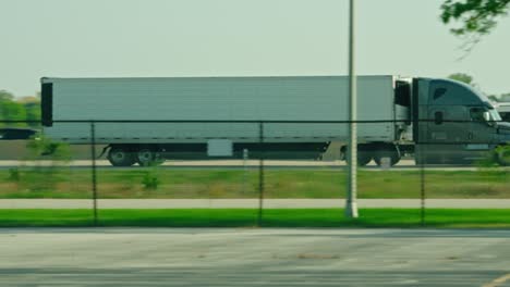 epic-slow-motion-of-a-reefer-semi-tractor-and-trailer-driving-on-interstate