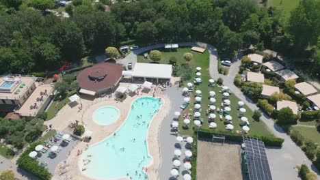 Aerial-Shot-of-Camping-Baia-Verde-Swimming-Pool-at-Lake-Garda,-Italy