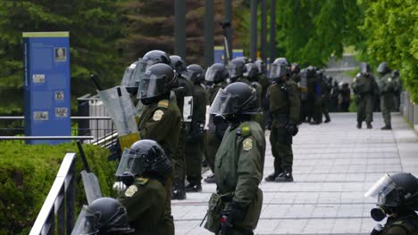 Riot-police-officers-guarding-during-a-rally-to-protest-the-G7-summit