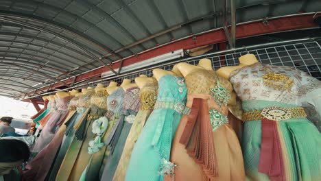 Shop-displaying-dresses-for-sale-in-Bangkok,-a-glimpse-of-local-small-scale-commerce