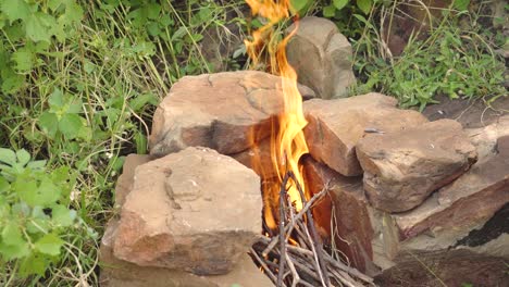 A-small-wild-campfire-during-day-time-for-outdoor-cooking
