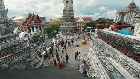 tourists-traveling-at-Wat-Arun-Ratchawararam-,-one-of-the-famous-place-in-Bangkok,-Thailand