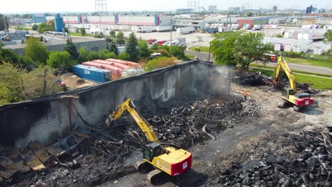 Yellow-excavator-destroys-a-building