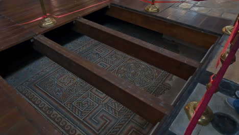 Floor-mosaic-in-the-Church-of-the-Nativity-roped-off-and-below-wooden-beams