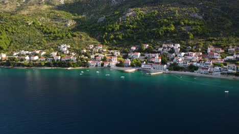 Aerial-View-Of-Village-Brist-On-The-Coast-Of-Adriatic-Sea,-Makarska-Riviera-In-Southern-Dalmatia,-Croatia---drone-shot