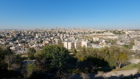 High-angle-pan-across-Jerusalem-city-sprawling-off-into-the-distance