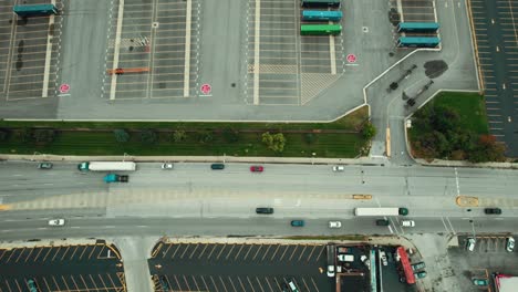top-down-tracking-aerial-of-a-local-green-semi-tractor-and-trailer