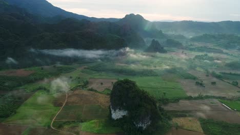 Aerial-View-of-Peaceful-Rural-Village-Surrounded-by-Mountain