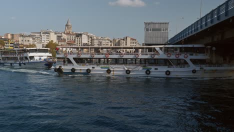 Double-decked-ferry-passenger-cruise-boats-sail-low-clearance-Galata-bridge