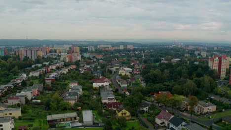 Aerial-drone-shot-of-a-czech-big-city-Ostrava-with-buldings,-cars,-roads-and-apartments-during-cloudy-day