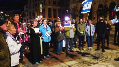 A-group-of-people-gathering-in-front-of-a-speaker-in-support-of-Israel-in-their-fight-against-terrorist-Hamas-in-Portland-Maine