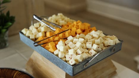 Sharp-Cheddar,-American,-and-Swiss-Cheese-Cubes-on-Charcuterie-Display-Food-Table
