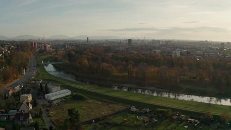 Aerial-drone-shot-of-a-czech-big-city-Ostrava-with-buldings,-cars,-roads,-apartments,-power-plant-and-towers-during-autumn-fall-day