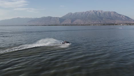 Waverunner-Rider-on-Utah-Lake-with-Timpanogos-Mountain-Backdrop,-Aerial