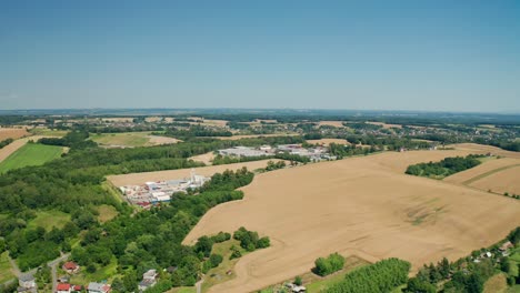 Aerial-drone-shot-of-czech-wheat-fields-and-forests-during-summer
