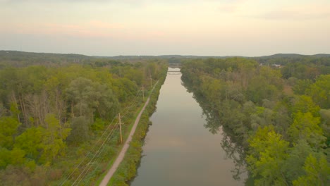 Erie-Canal-drone-shot-at-sunset-near-Downtown-Palmyra-in-New-York-State-USA