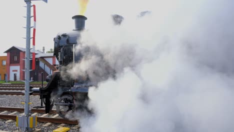 Black-historical-locomotive-moving-away