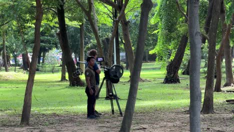 TV-filming-crews-film-the-nature-of-this-multi-functional-Lumpini-Park-in-Bangkok,-Thailand