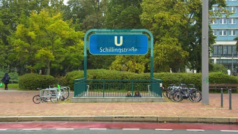 Entrance-to-Underground-Station-in-Berlin-Mitte-next-to-Road-on-Rainy-Day
