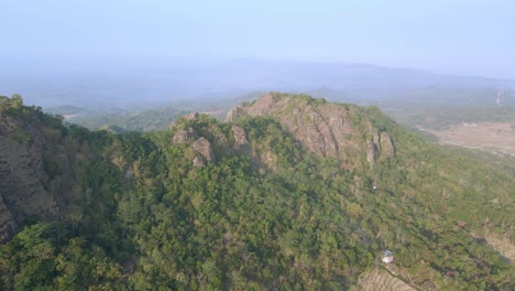 Drone-view-of-rock-hill-with-tropical-forest
