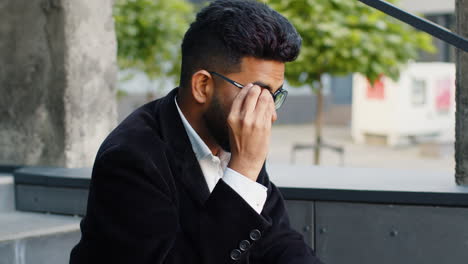 Unhappy-sad-Indian-business-man-frustrated-stress-pensive-feeling-bad-after-company-unemployment