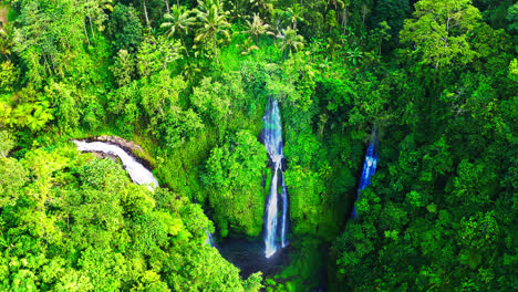 Fiji-waterfalls-cascading-down-to-lagoon-in-lush-rainforest-in-Bali