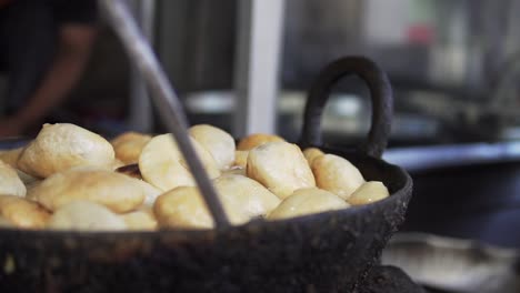 A-delicious-local-street-food,-Kachori-being-prepared-in-a-Local-market-in-North-India