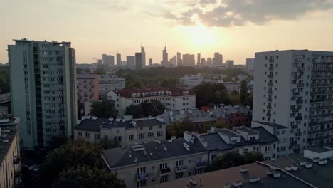 Residential-buildings-at-Warsaw-suburbs,-Poland-with-scenic-city-center-skyline,-aerial