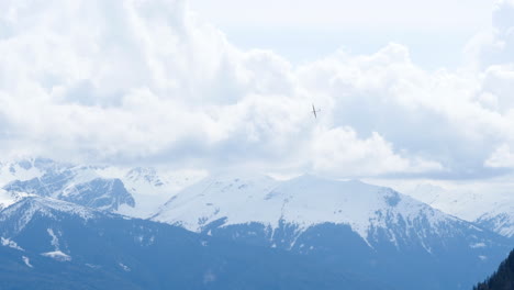 Tracking-shot-of-Sailplane-flying-over-snow-covered-Austrian-Alps,-Innsbruck