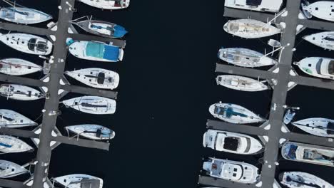 Aerial-rising-rotating-shot-showing-the-rows-of-boats-docked-at-Shilshole-Marina,-Seattle