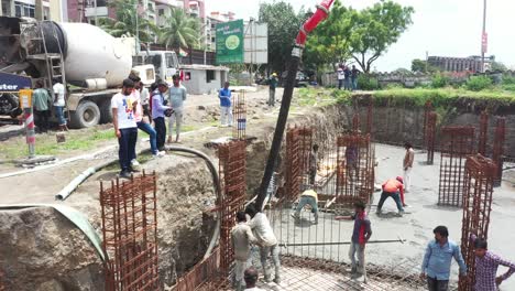 The-construction-work-of-the-high-rise-building-is-going-on-in-which-the-basement-is-being-built-and-concrete-and-cement-is-being-filled