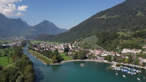 Aerial-drone-view-of-Weesen-town-based-near-shore-of-Walensee-lake,-Switzerland