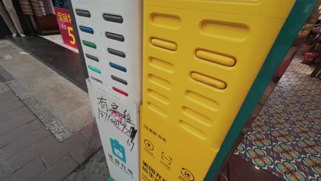 Power-bank-station-vandalized-with-numerous-writings-placed-in-the-shop-street-in-China