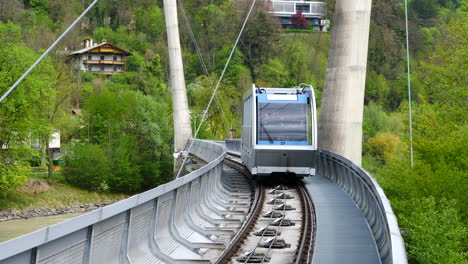 Car-arriving-at-Hungerburgbahn-hybrid-funicular-station,-Innsbruck,-Austria
