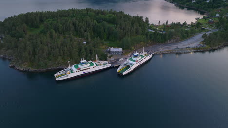 Two-ferries-docked-at-Dragsvik-ferry-slip-on-Sognefjord,-Balestrand