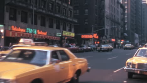 Illuminated-Storefront-Signs-in-Manhattan-Downtown-New-York-in-Archival-1970s