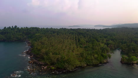 Coastline-peninsula-in-Thailand-with-palm-tree-jungle-grove-at-dusk