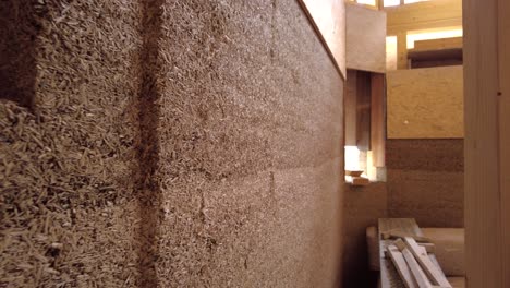 Close-up-of-hempcrete-wall-from-the-side-passing-by