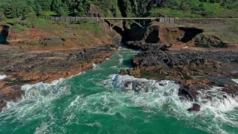 Located-in-the-Cape-Perpetua-Scenic-Area,-just-three-miles-south-of-Yachats-Oregon,-Thor's-Well-is-a-bowl-shaped-hole-carved-out-of-the-rough-basalt-shoreline