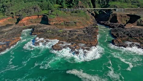 Located-in-the-Cape-Perpetua-Scenic-Area,-just-three-miles-south-of-Yachats-Oregon,-Thor's-Well-is-a-bowl-shaped-hole-carved-out-of-the-rough-basalt-shoreline