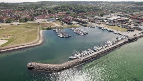 Beautiful-Scenery-with-Danish-Marina-and-Small-Costal-Town---Aerial-View
