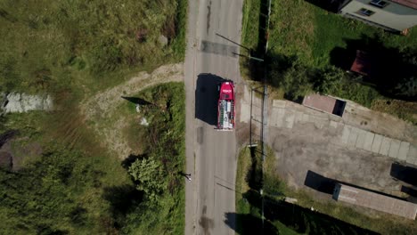 Following-Drone-Shot-of-Fire-Truck-Coming-Back-from-Action-in-Daylight