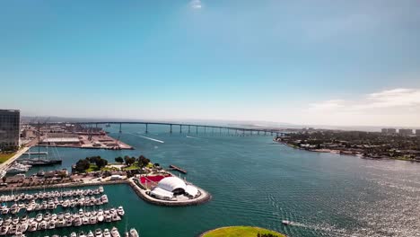 High-aerial-view-of-the-Rady-Shell-and-the-San-Diego-Coronado-Bridge-with-lots-of-boats-in-the-harbor