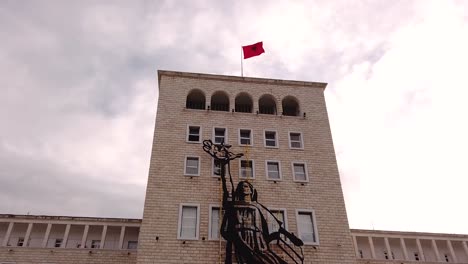 Hyperlapse-of-Albanian-flag-waving-on-Polytechnic-University-of-Tirana-building