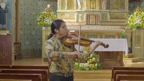Violinist-Playing-Violin-Music-Instrument-in-Church,-Solo-Rehearsal-at-Medalla-Milagrosa-Church-in-Ecuador