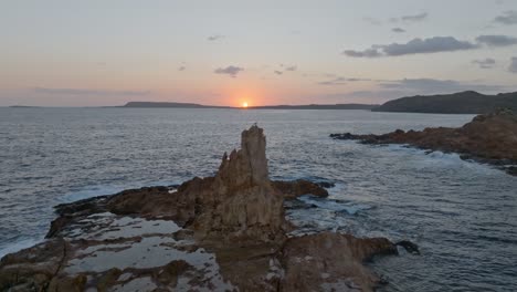 Stunning-view-of-rock-formations-in-the-sea-at-sunrise-at-Cala-Pregonda