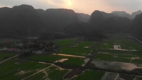 Famous-Ninh-Binh-tamcoc-Vietnam-rice-fields-during-sunrise,-aerial