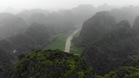 Panorama-view-of-the-beautiful-rice-fields-at-Ninh-Binh-Vietnam,-aerial
